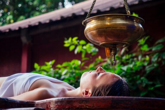ayurveda massage alternative healing therapy.beautiful caucasian female getting